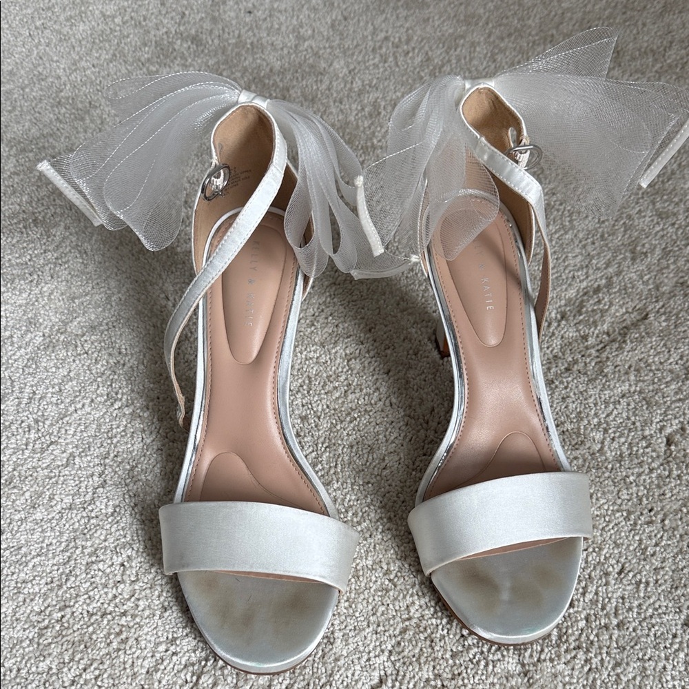 Elegant White Women's heels with bow detail